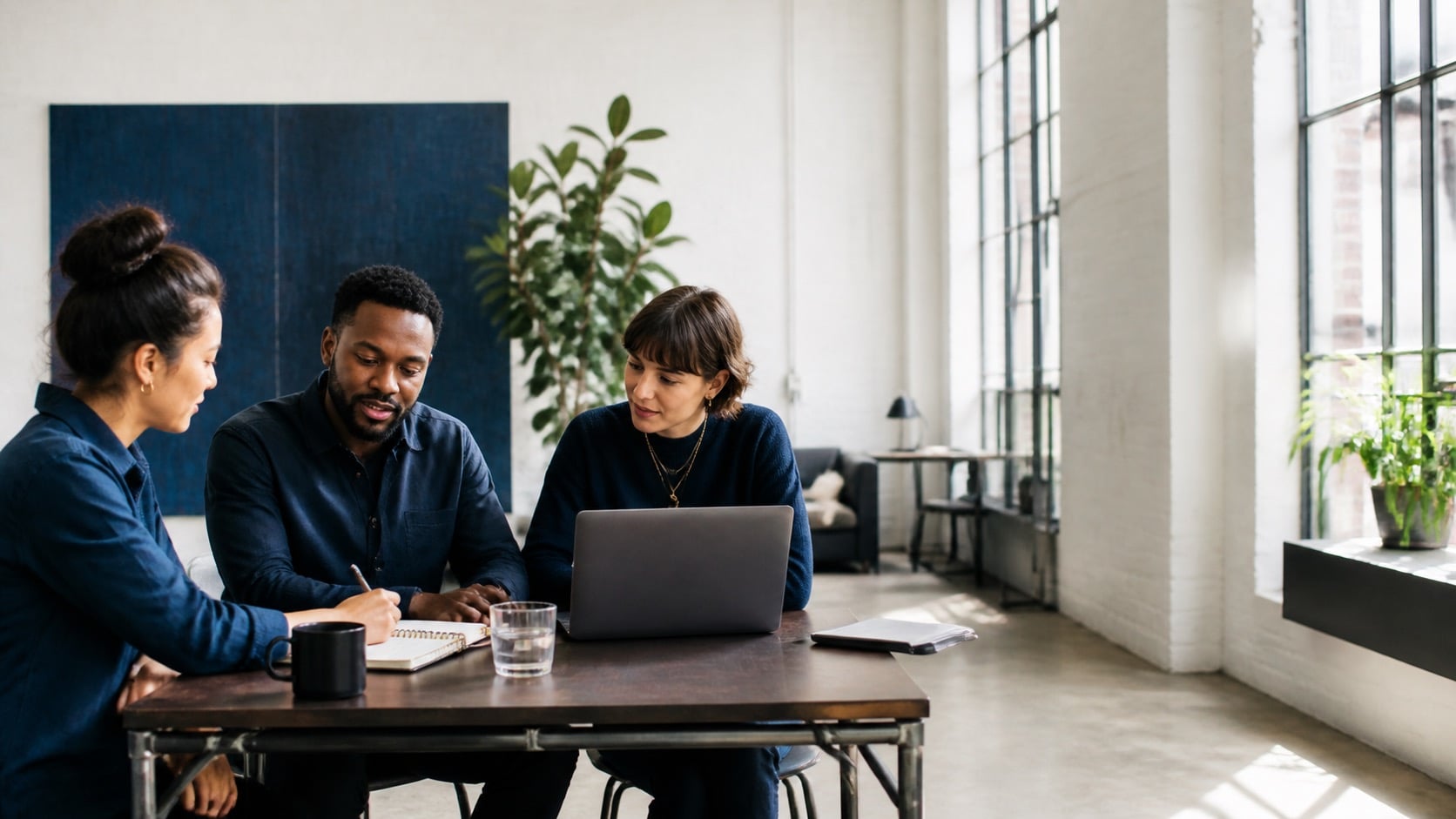People discussing ideas together around a table