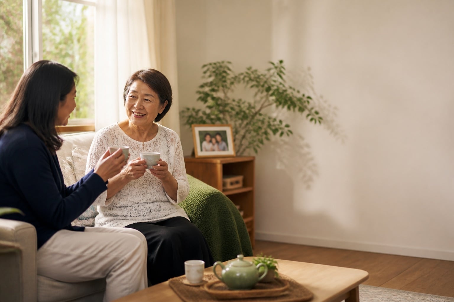 Two family members sharing tea at home