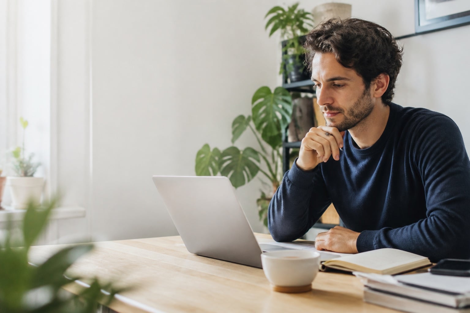 Person reviewing information at a laptop